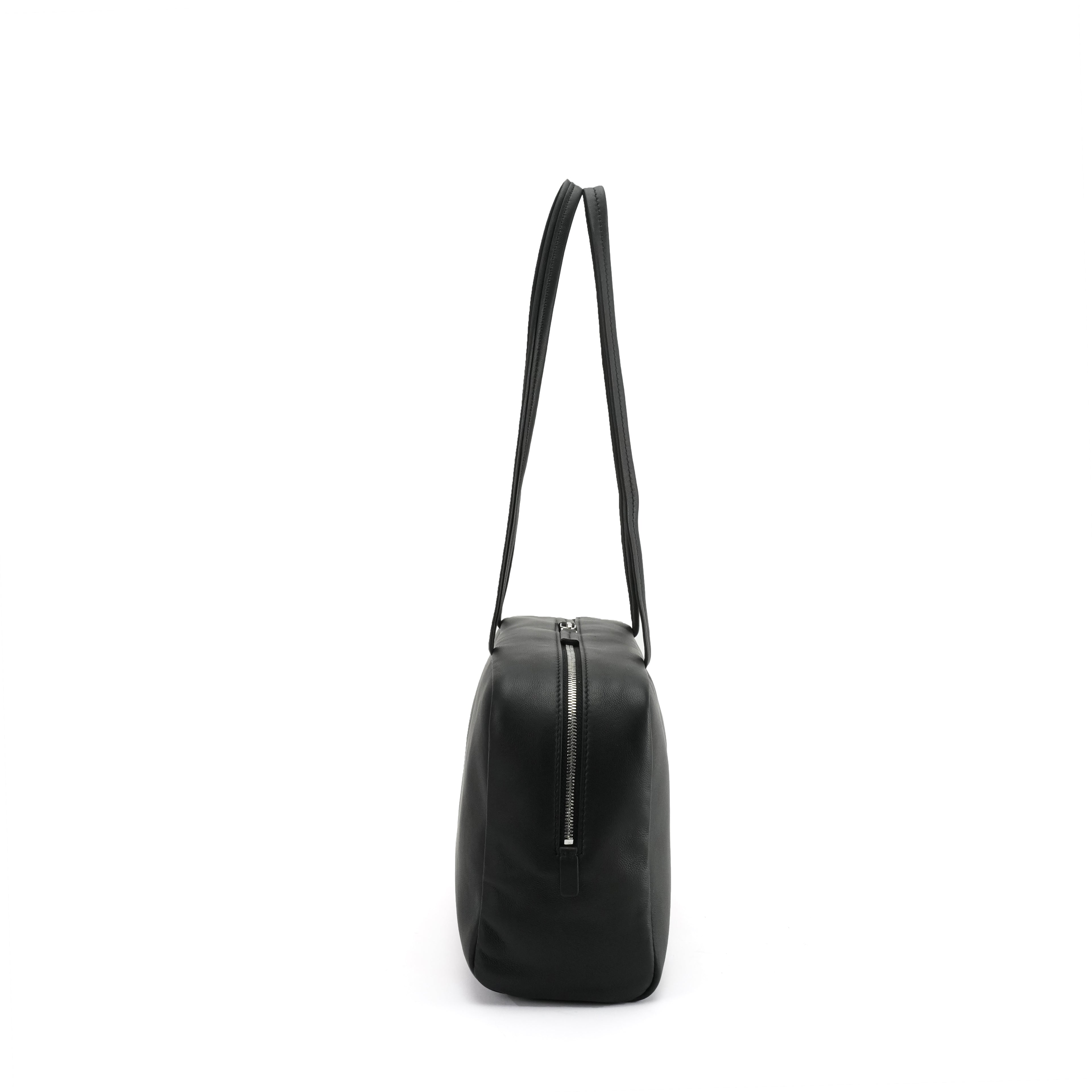 Black east-west bowling tote side profile and zipper depth