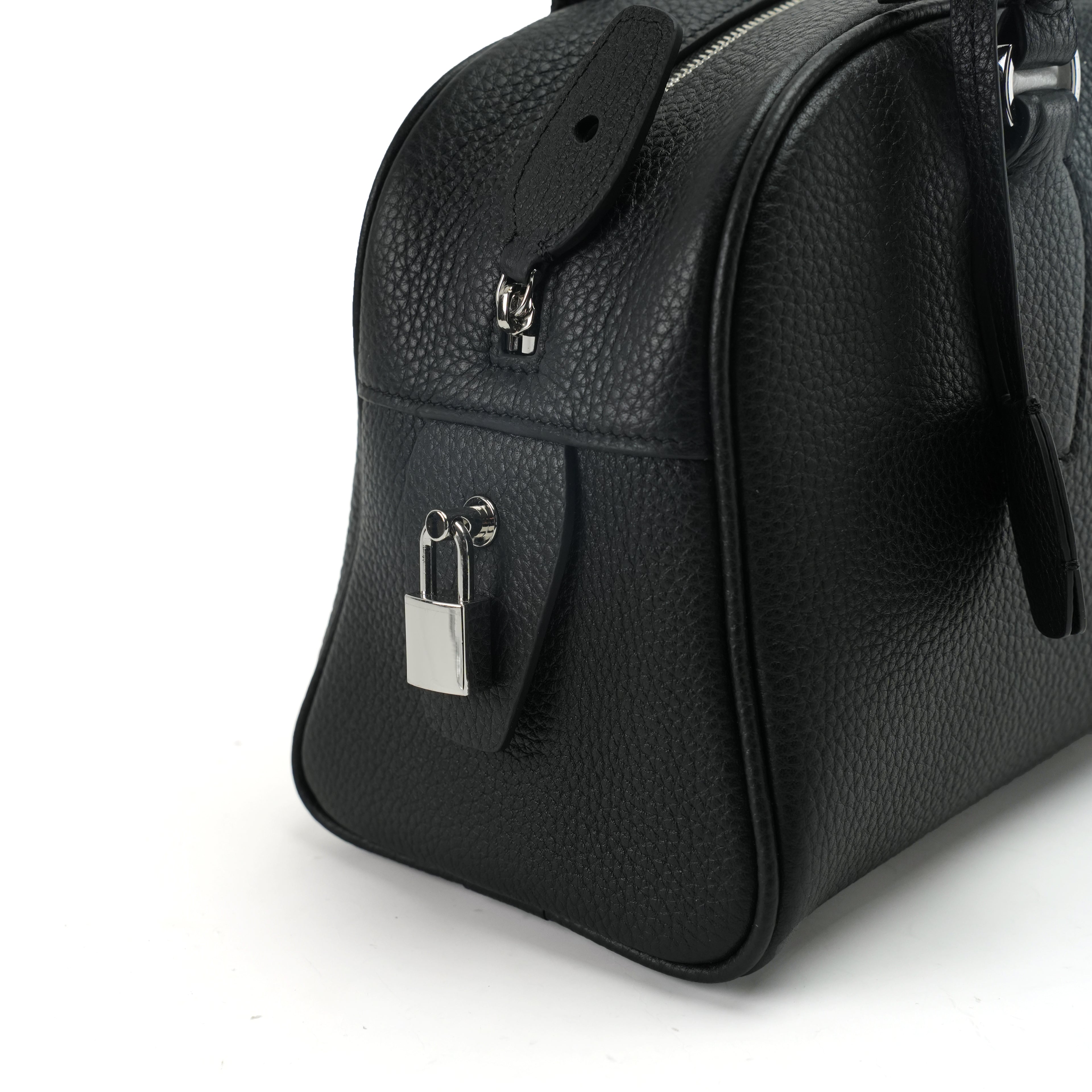 Boston shoulder bag padlock and handle attachment detail