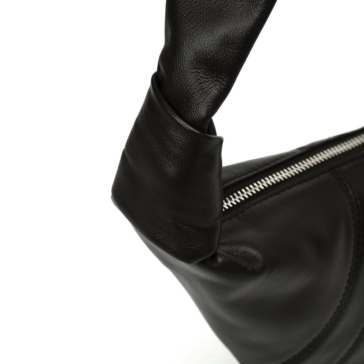 Black knot-handle hobo bag handle and zipper close-up