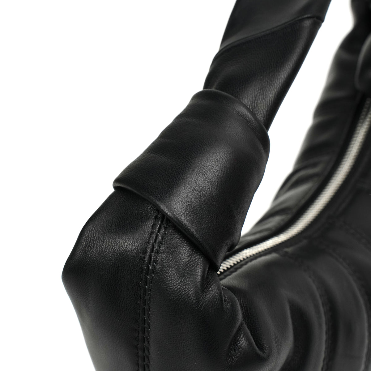 Black knot-handle hobo seam and handle attachment detail